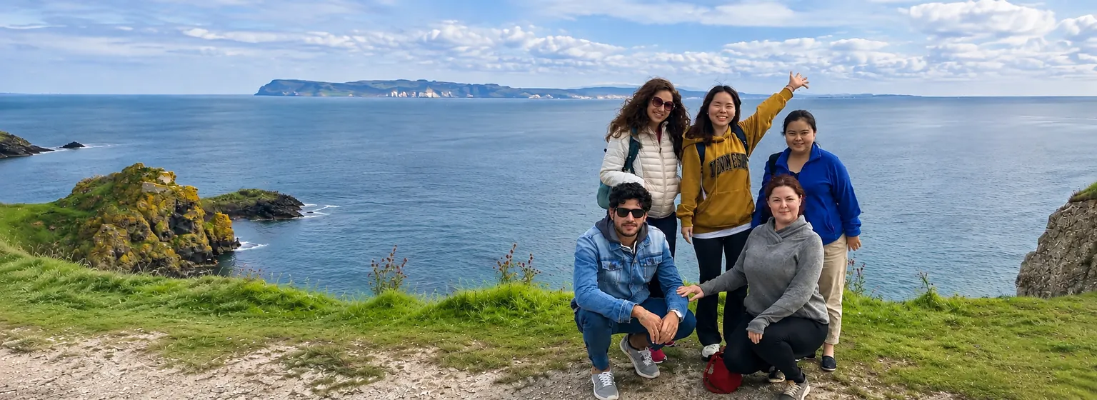 Adult C2 English immersion students enjoying an Irish coastal viewpoint